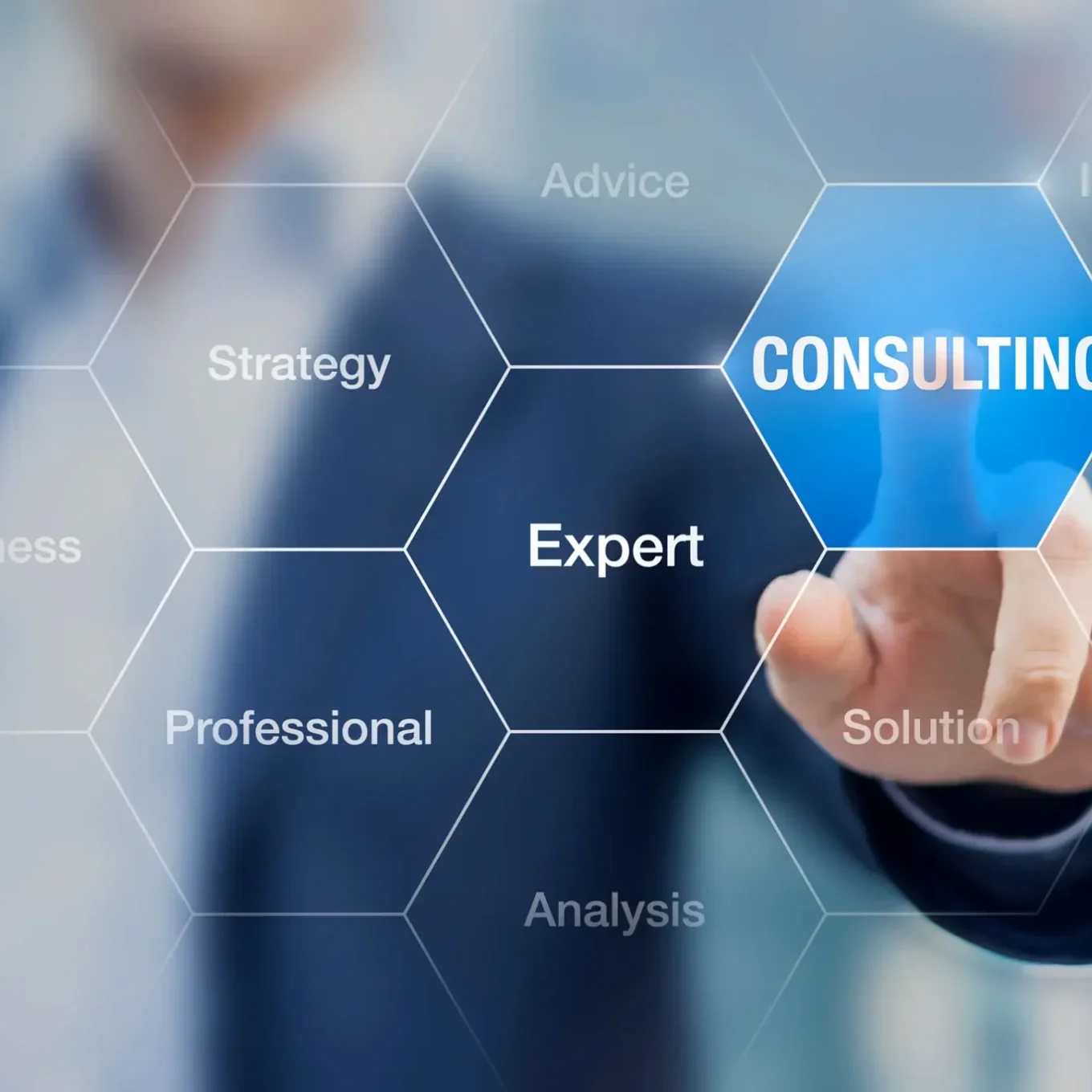 Hand pointing to the word 'Consulting' on a hexagonal digital interface.